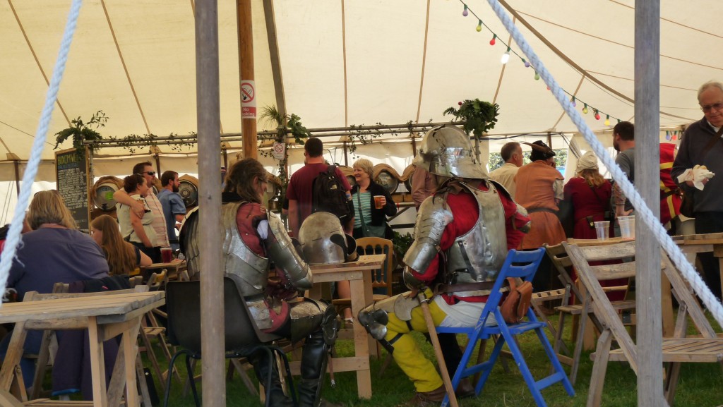 Herstmonceux Medieval Festival - knight on blue chair