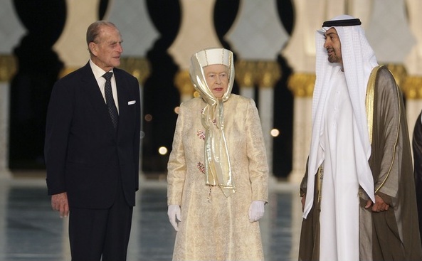 Britain's Queen Elizabeth and her husband Prince Philip stand next to Abu Dhabi's Crown Prince Sheikh Mohammed bin Zayed during their visit at the Sheikh Zayed Grand Mosque in Abu Dhabi