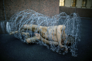 Russian Artist Wrapped In Barbed Wire - Art Shot